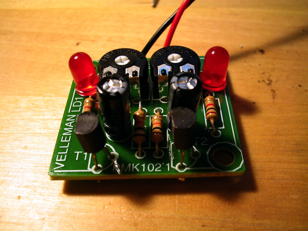 PLACEHOLDER (stock photo, to be replaced with Jeff's own build photo) — A generic electronics-kit soldering scene: components seated on a circuit board mid-assembly, the kind of methodical through-…