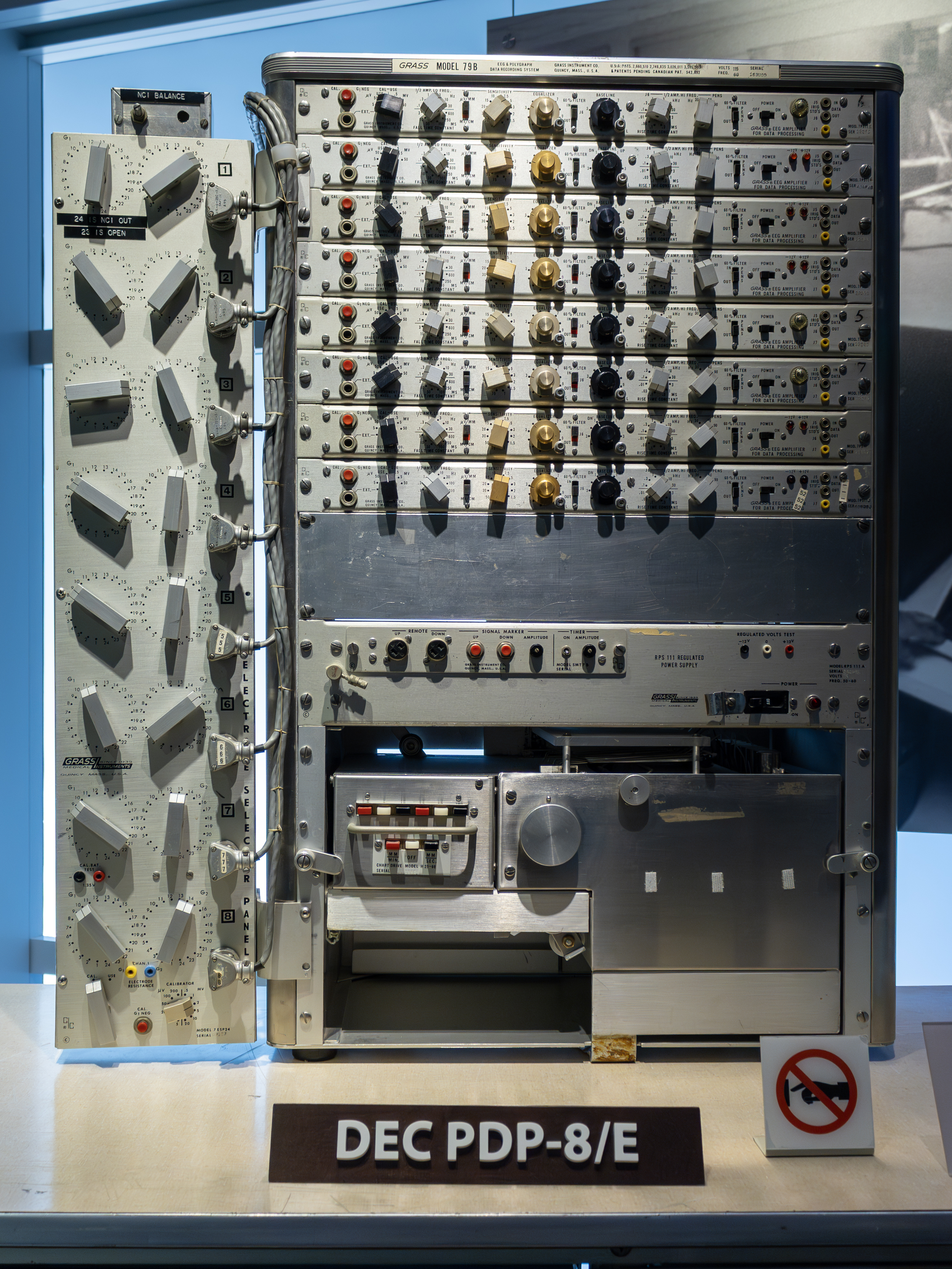 A PDP-8/E (1970) in service — the Omnibus generation that unified the family's processor, memory, and I/O onto a single shared bus, here configured as a clinical data-acquisition station. The same …